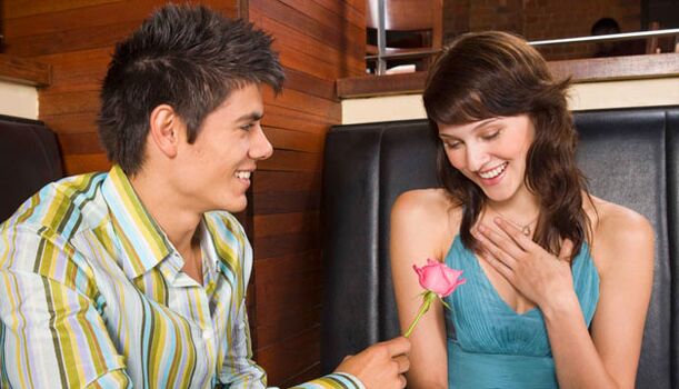 Excited man showing attention to woman