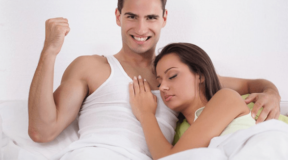 a woman in bed with a man having increased power
